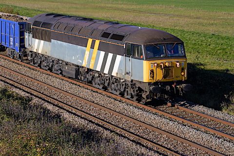 A Class 56 locomotive in close up running along a countryside setting