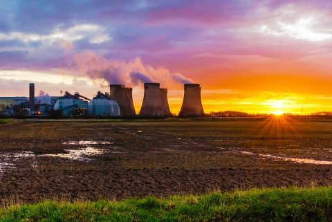 Drax power station at sunset with marshland in foreground